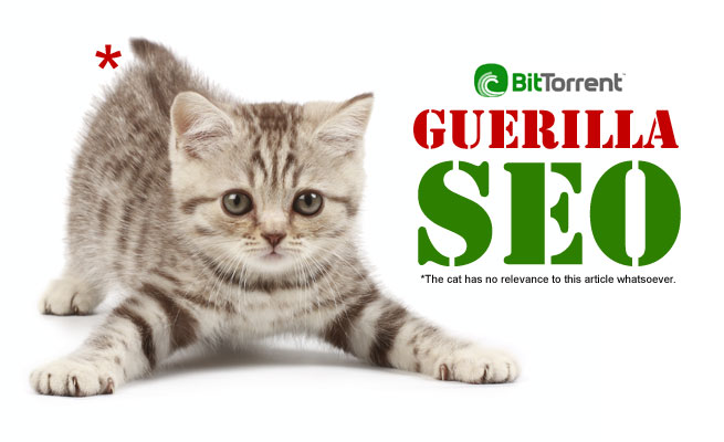 A kitten sprawled on a white background beside the BitTorrent logo and the words GUERILLA SEO, with a footnote reading: The cat has no relevance to this article whatsoever.
